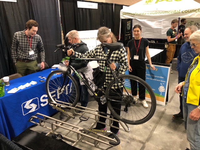 SEPTA booth at the 2024 Philly Bike Expo - with demonstration bus bike rack.